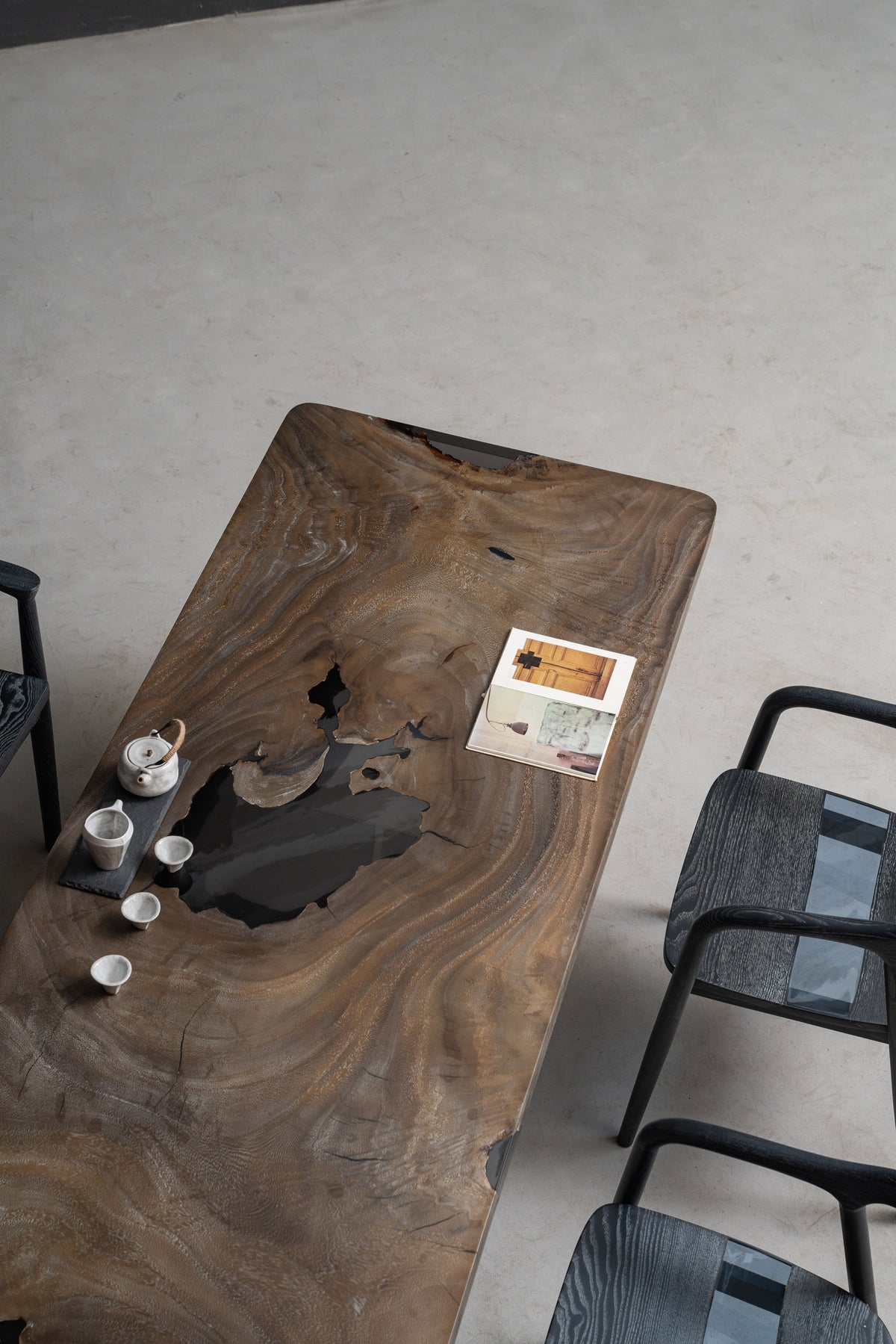 Overhead view of Basin Meridian rainwood table revealing sculpted live edges, balanced proportions, and surface depth.