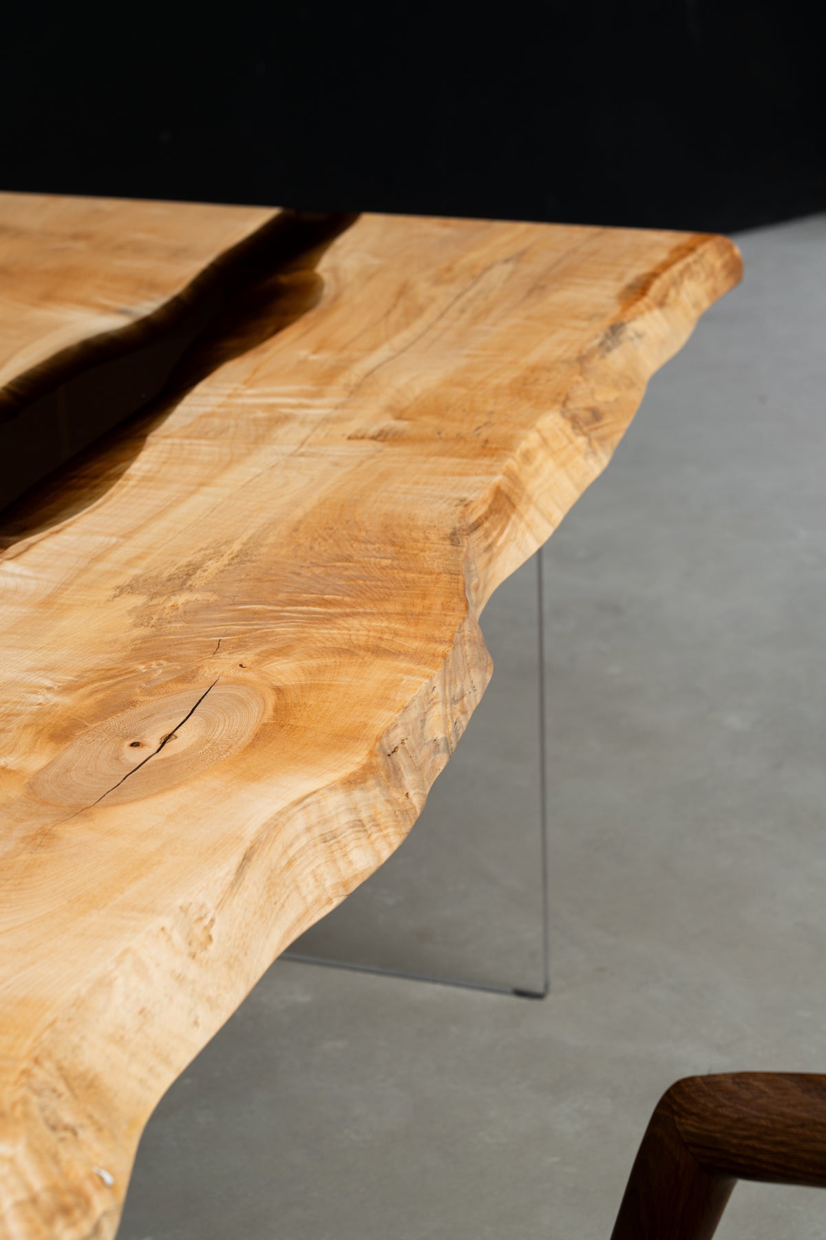 Close-up of Japanese Tochi live edge highlighting natural contour and amber wood grain