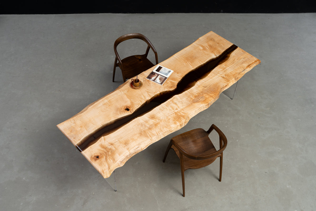 Wide-angle view of Japanese Tochi live-edge dining table with resin river by Woodslabs