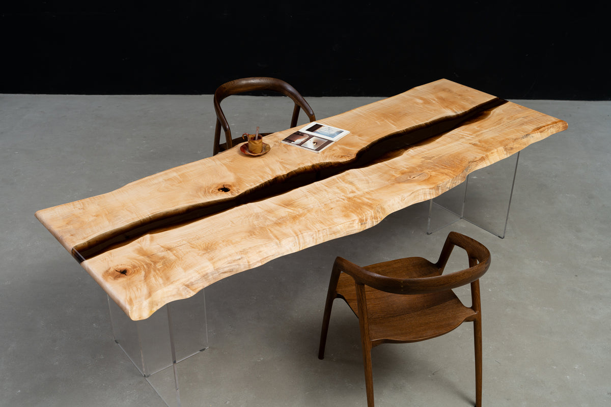 Wide-angle view of Japanese Tochi live-edge dining table with resin river and sculptural presence by Woodslabs