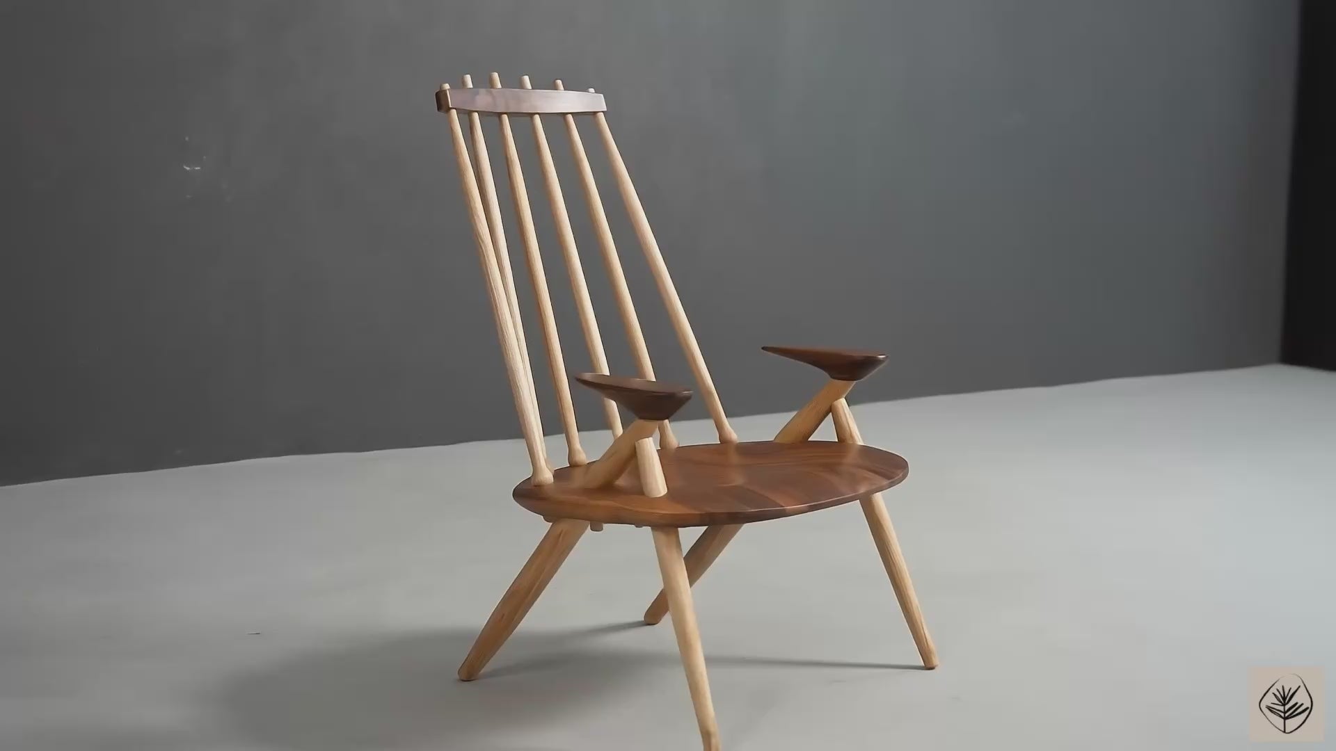 Arcadia lounge chair in black walnut with ash spindle backrest by Woodslabs