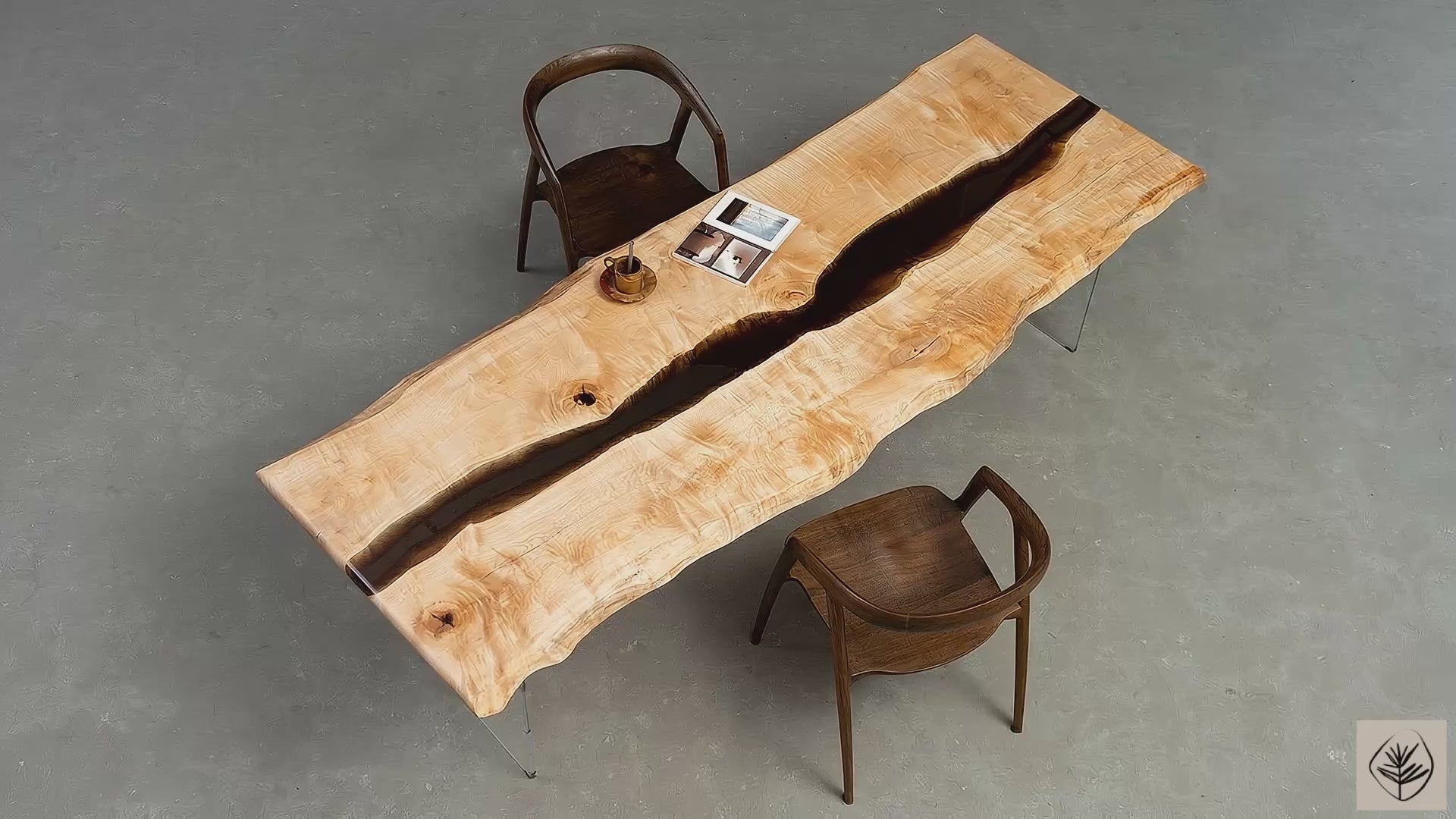 Full table overview of Tochi Legacy live edge rainwood table on transparent resin legs in studio setting