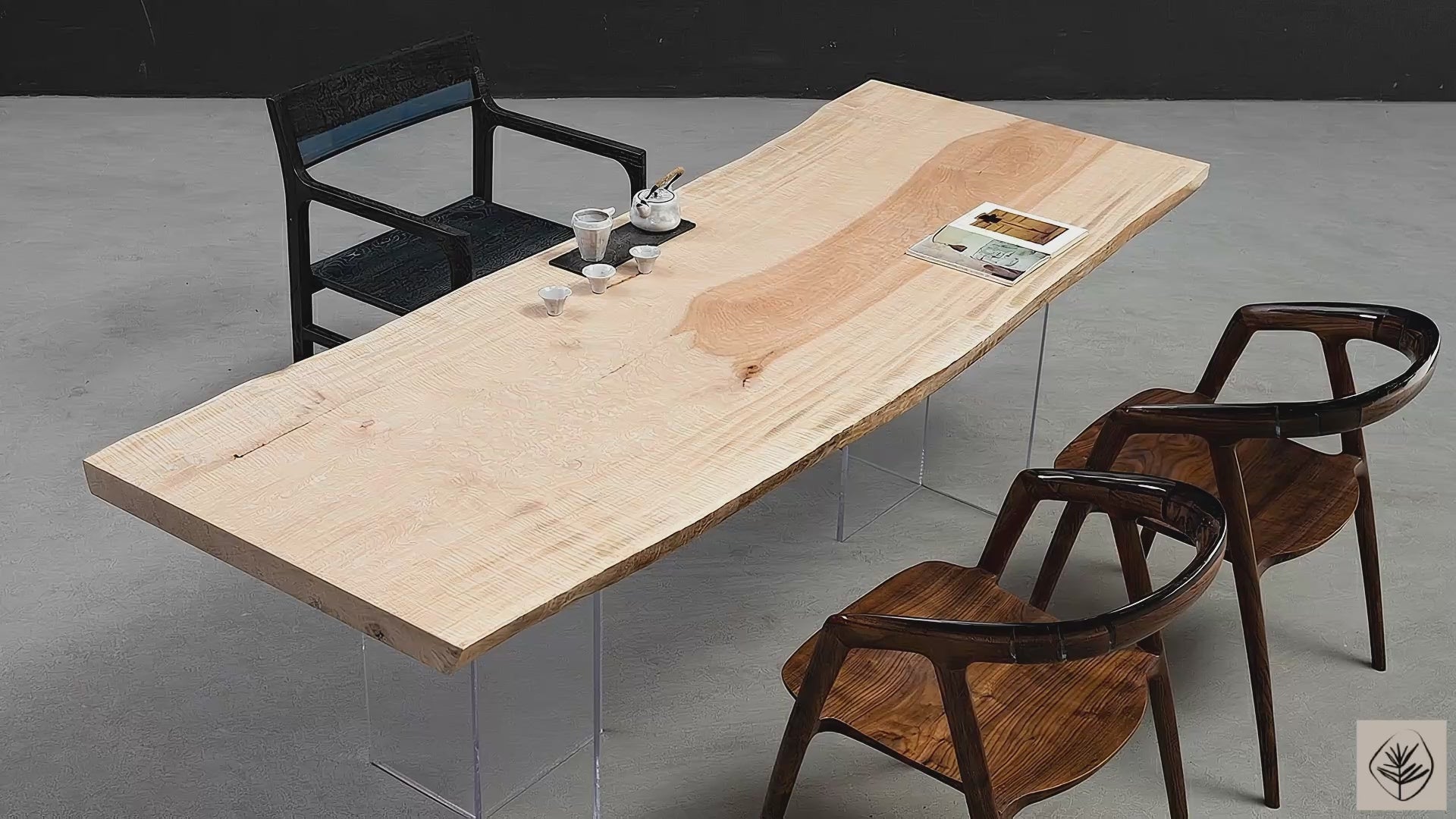 Full table overview of Tochi Kodama live edge tochi table on transparent resin legs in studio setting