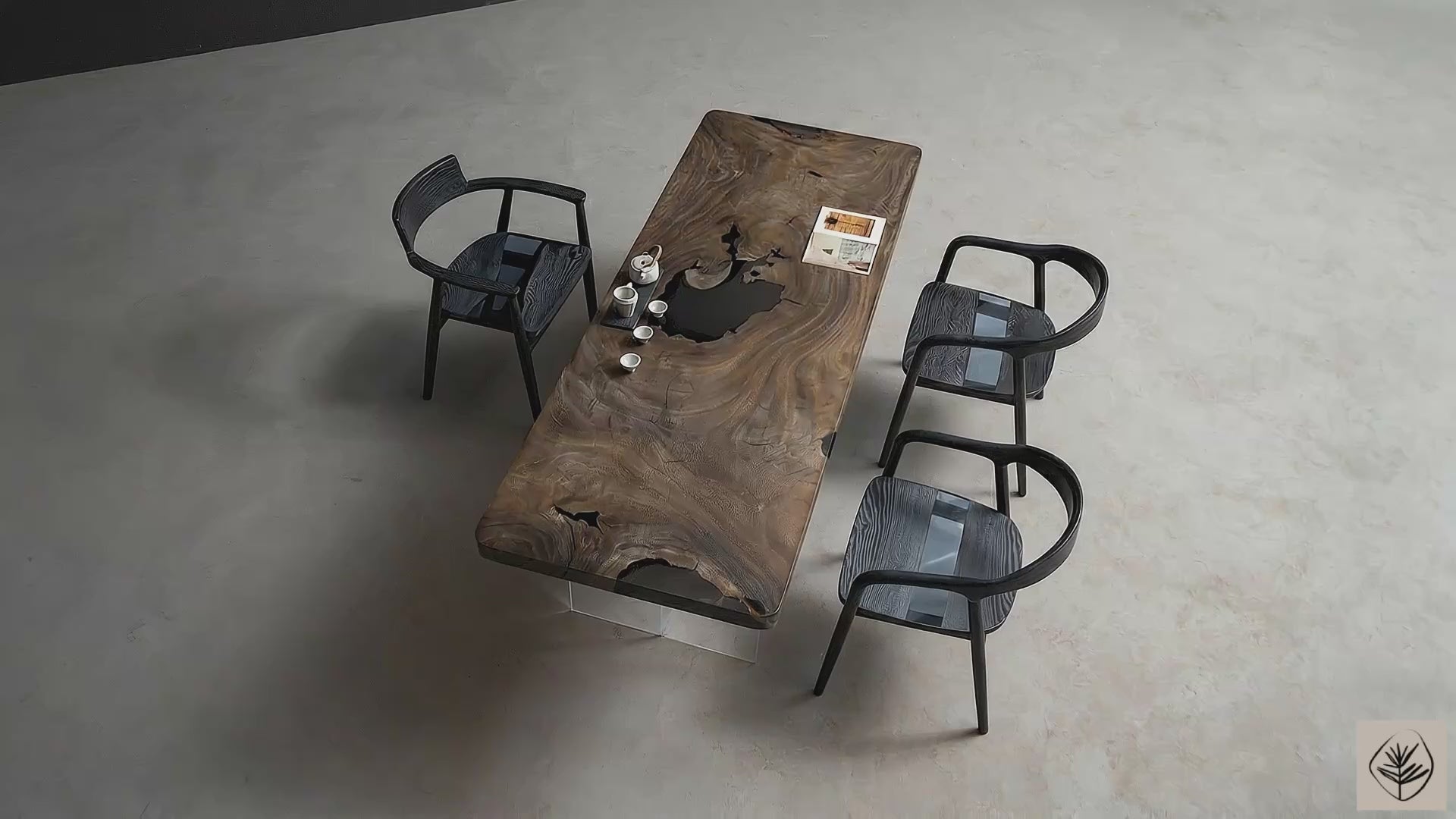 Full table overview of Meridian Basin live edge rainwood table on transparent resin legs in studio setting