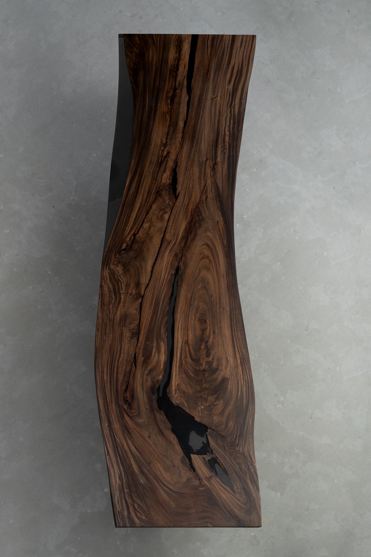 Rainfall Meridian live edge rainwood surface with layered grain and subtle resin accent underside surface