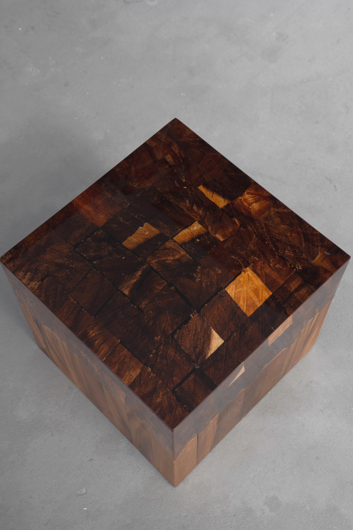 Overhead angled shot of the Cube of Origins showing epoxy resin and rainwood root details.