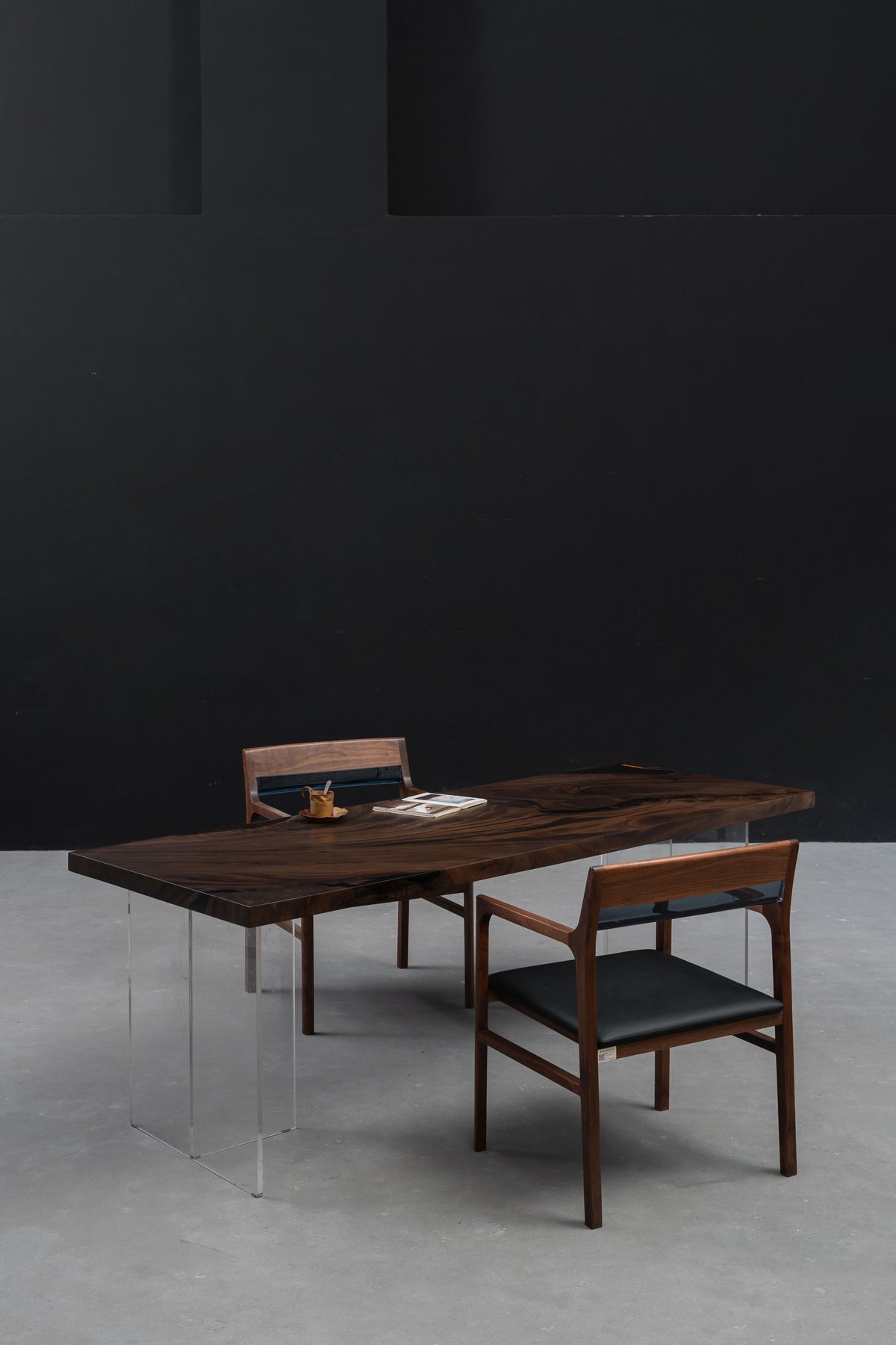 Meridian South Current rainwood dining table shown in a lifestyle setting, emphasising natural live edges and sculptural form.