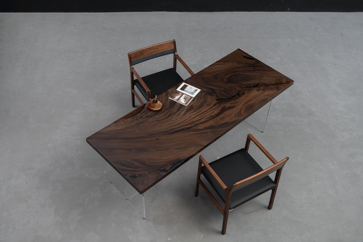 Overhead wide view of the Meridian South Current rainwood dining table showing full tabletop shape, and live-edge profile.