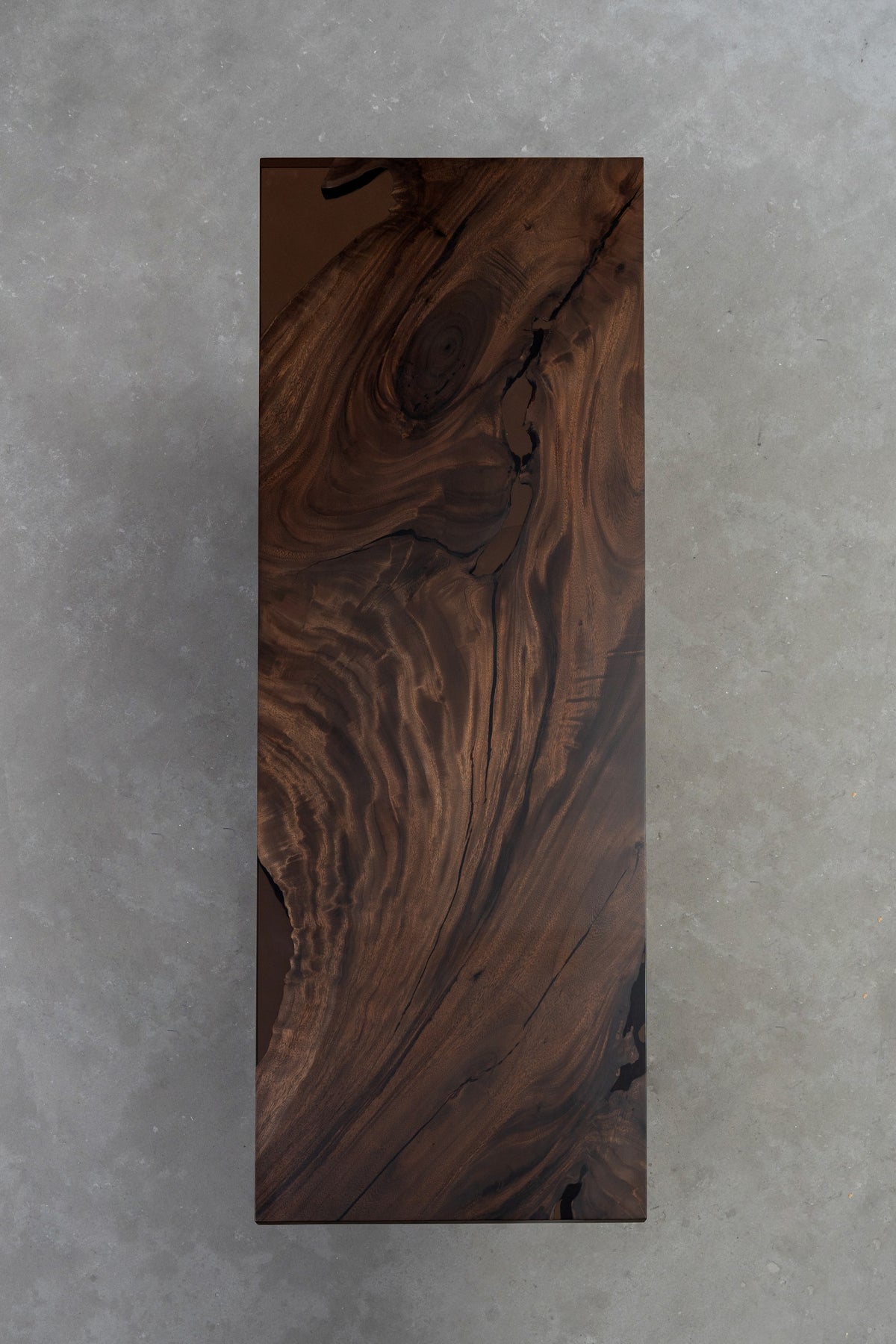 Overview of the Meridian South Current rainwood dining table highlighting overall form, live-edge profile, and natural grain.