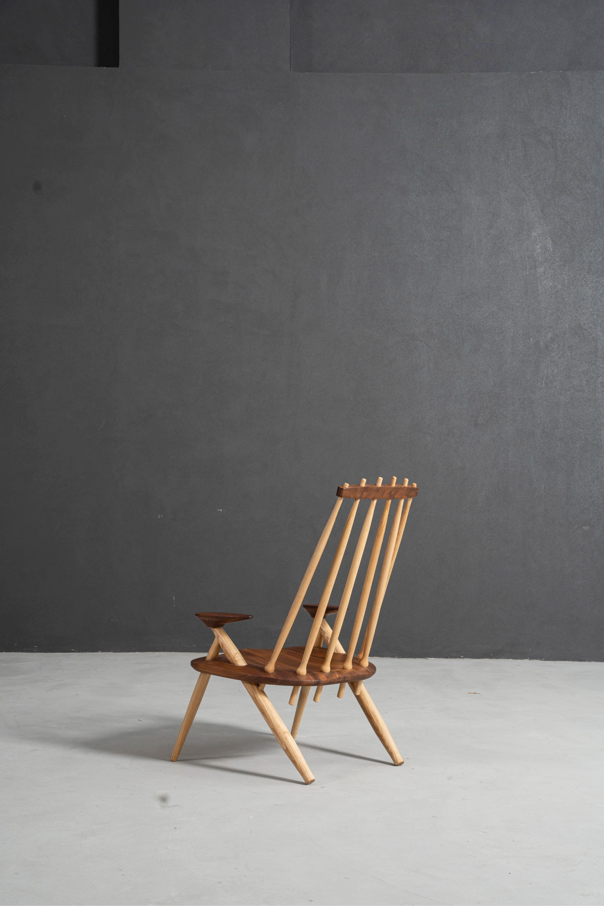 Side elevation view of Arcadia Chair featuring solid wood frame and spindle details.