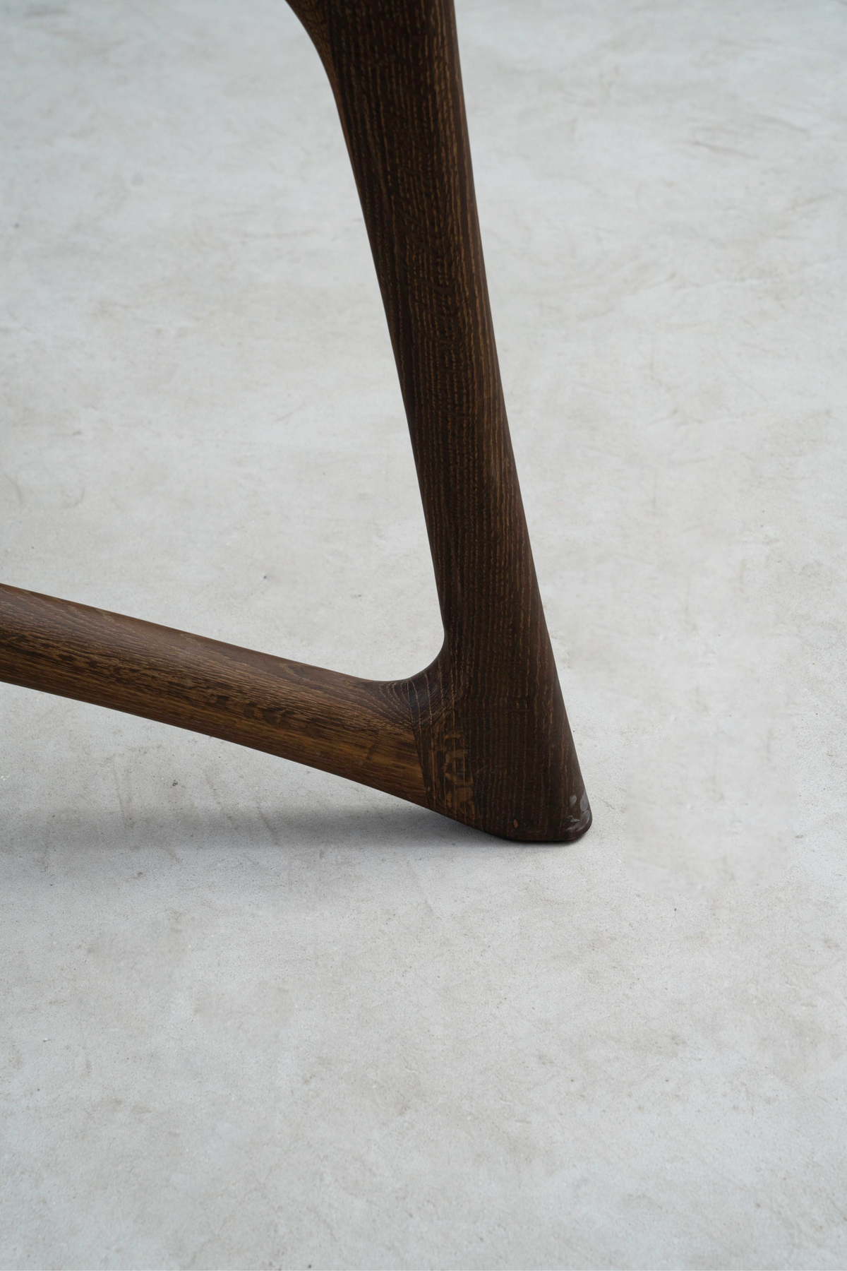 Macro shot of butterfly joint's base, revealing seamless wood inlay and bottom-edge finish.