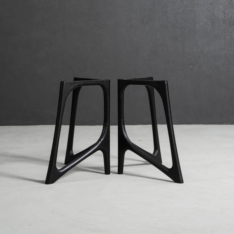 Butterfly Effect V-stand table base featuring mirrored V forms and strong architectural support