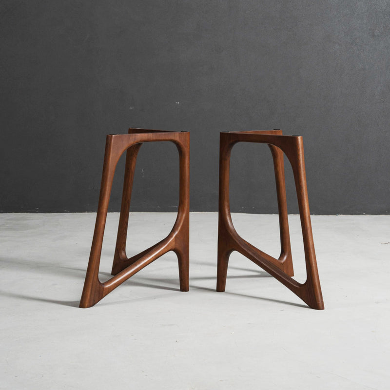 Butterfly Effect V-stand table base featuring mirrored V forms and strong architectural support