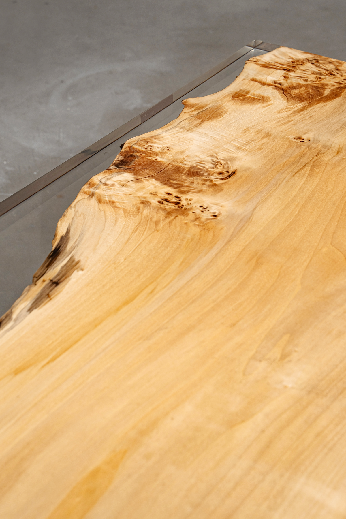 Close-up of poplar grain from the Clarity Prism Table with clear epoxy.