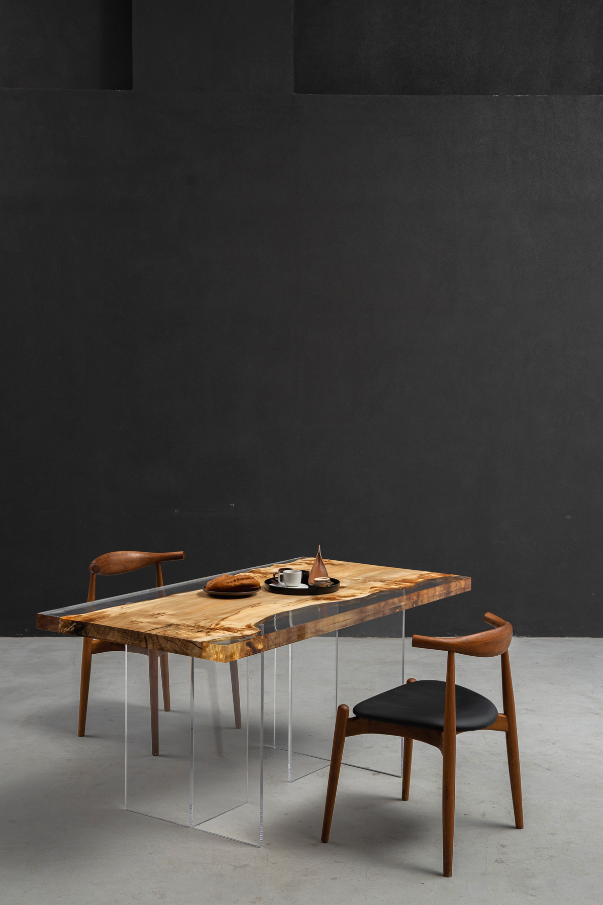 Clarity Prism Table on minimalist Silent T base, highlighting the transparent support system.