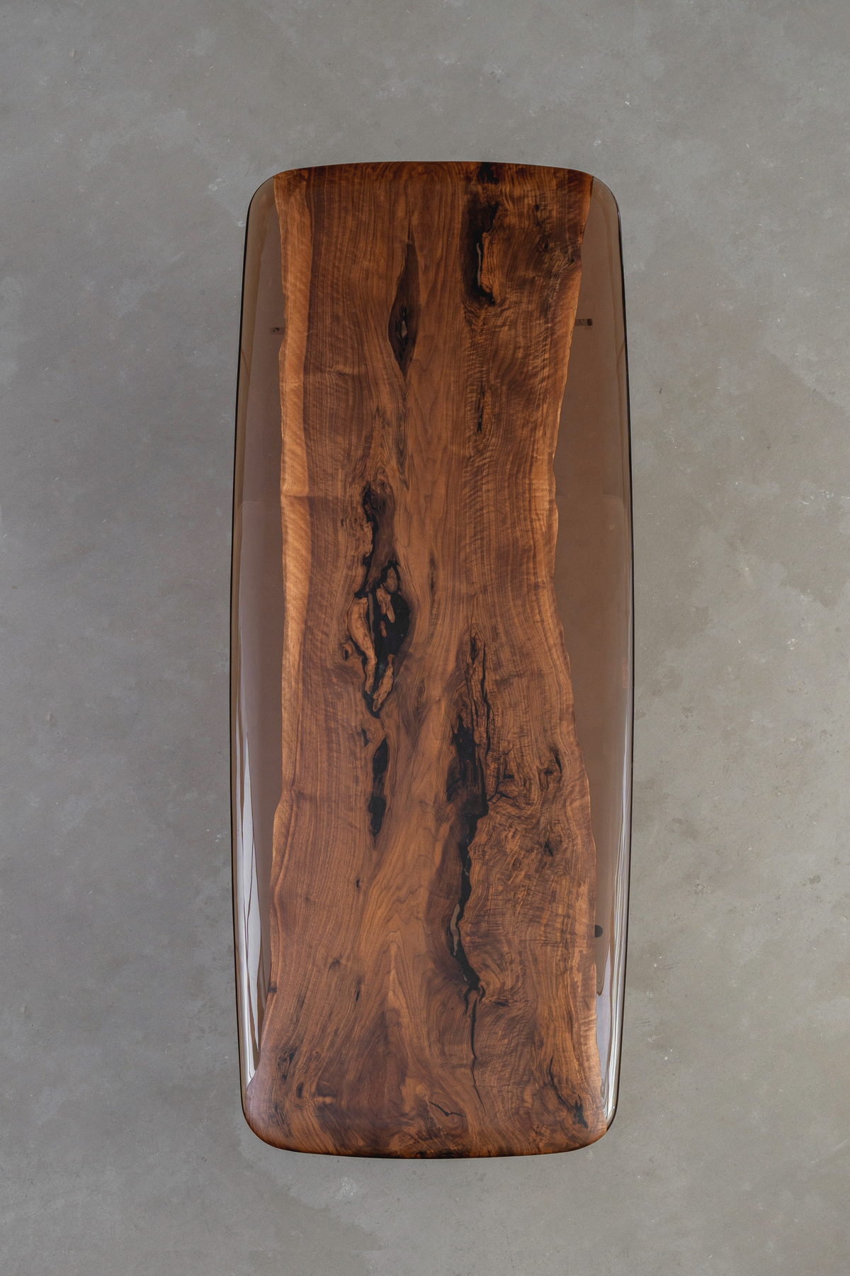 Aerial view of the Continental Table highlighting the walnut center and flowing earth-toned epoxy resin borders.