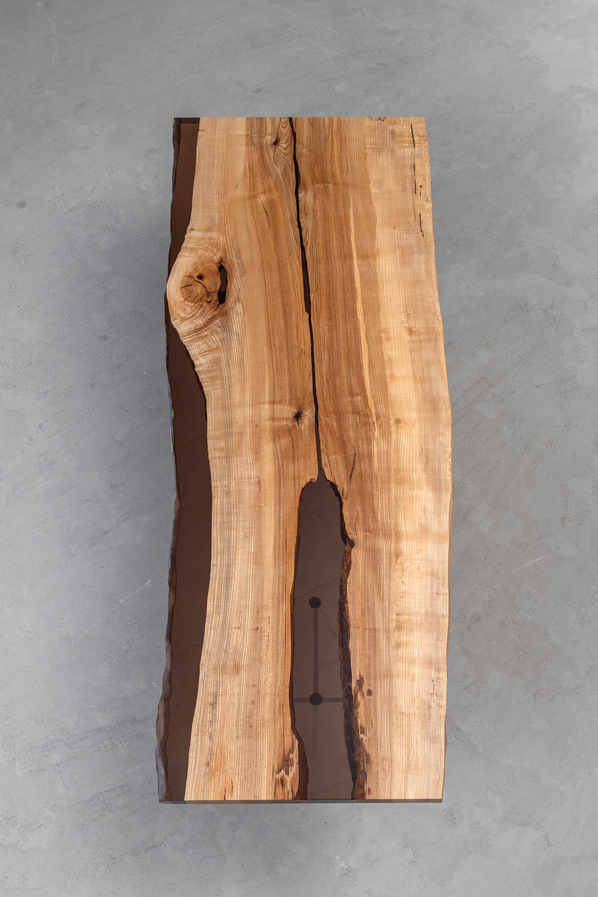 Aerial view of Convergence Table showcasing North American ash wood and earth tone epoxy.