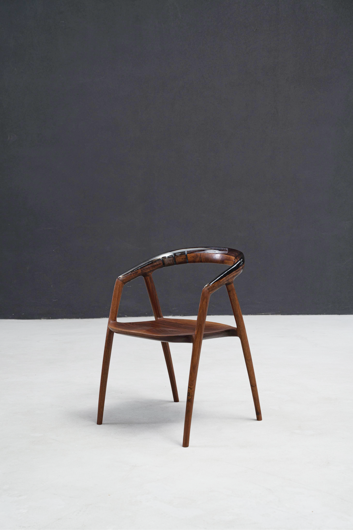 Full elegant presentation of Event Horizon Chair featuring crystalline resin and walnut craftsmanship.