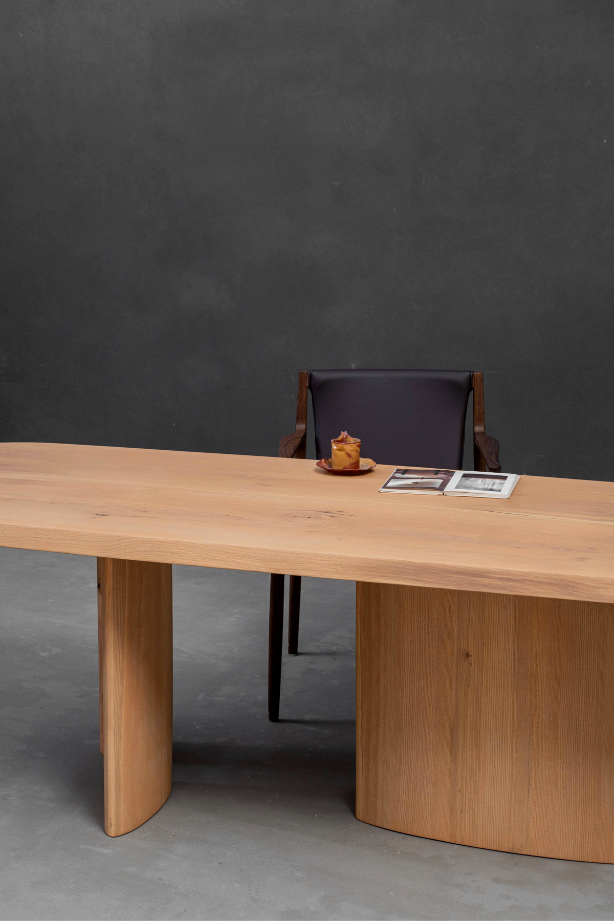 Close-up section highlighting the integrated construction of ash wood top and oak base on Fusion Table.
