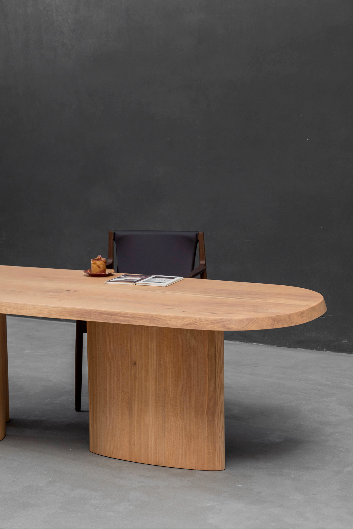 Fusion Table edge detail revealing the integrated construction of ash wood top and oak base.