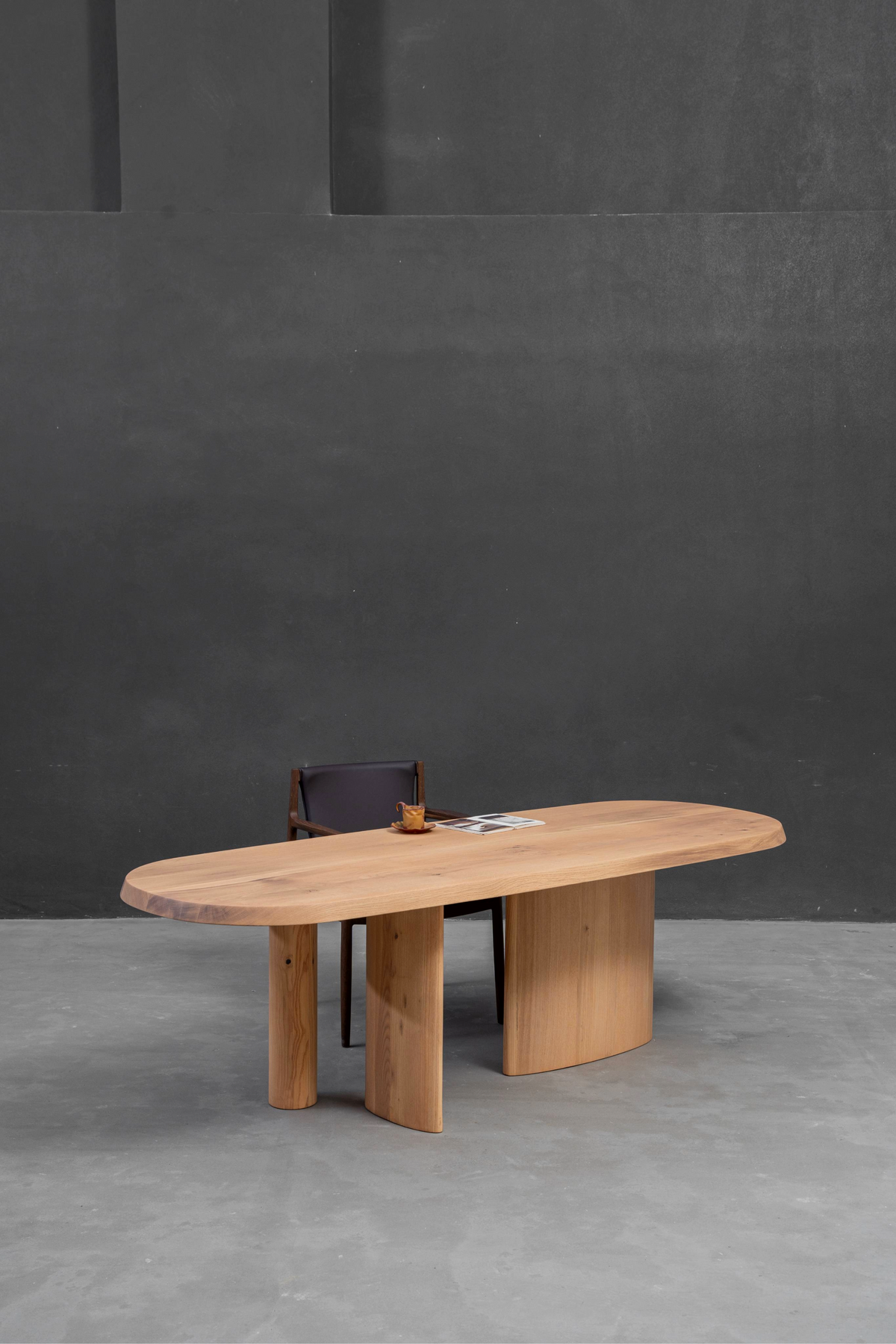 Full side view of Fusion Table highlighting the tonal harmony between ash top and oak base.
