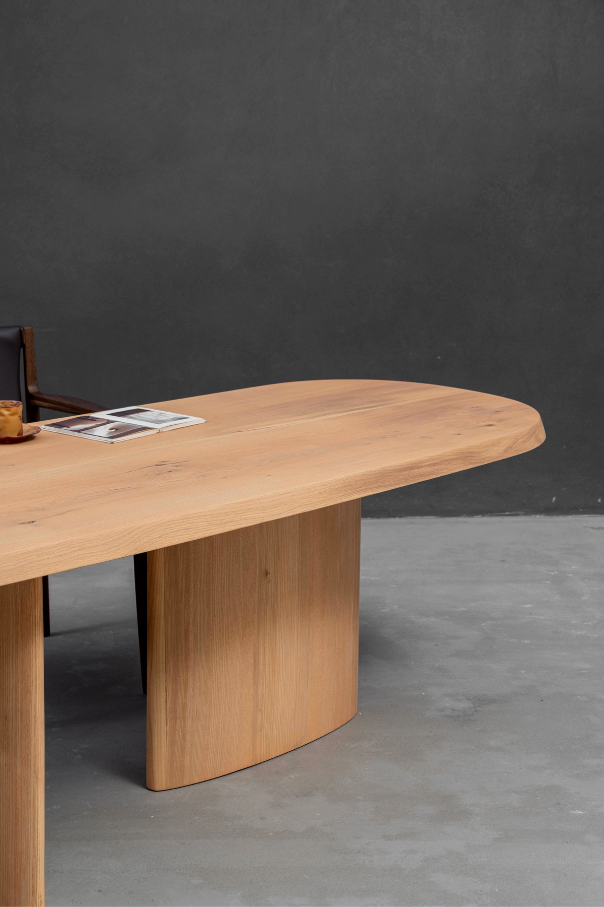 Side angle detail shot showing Fusion Table's white ash edge and section of white oak base.