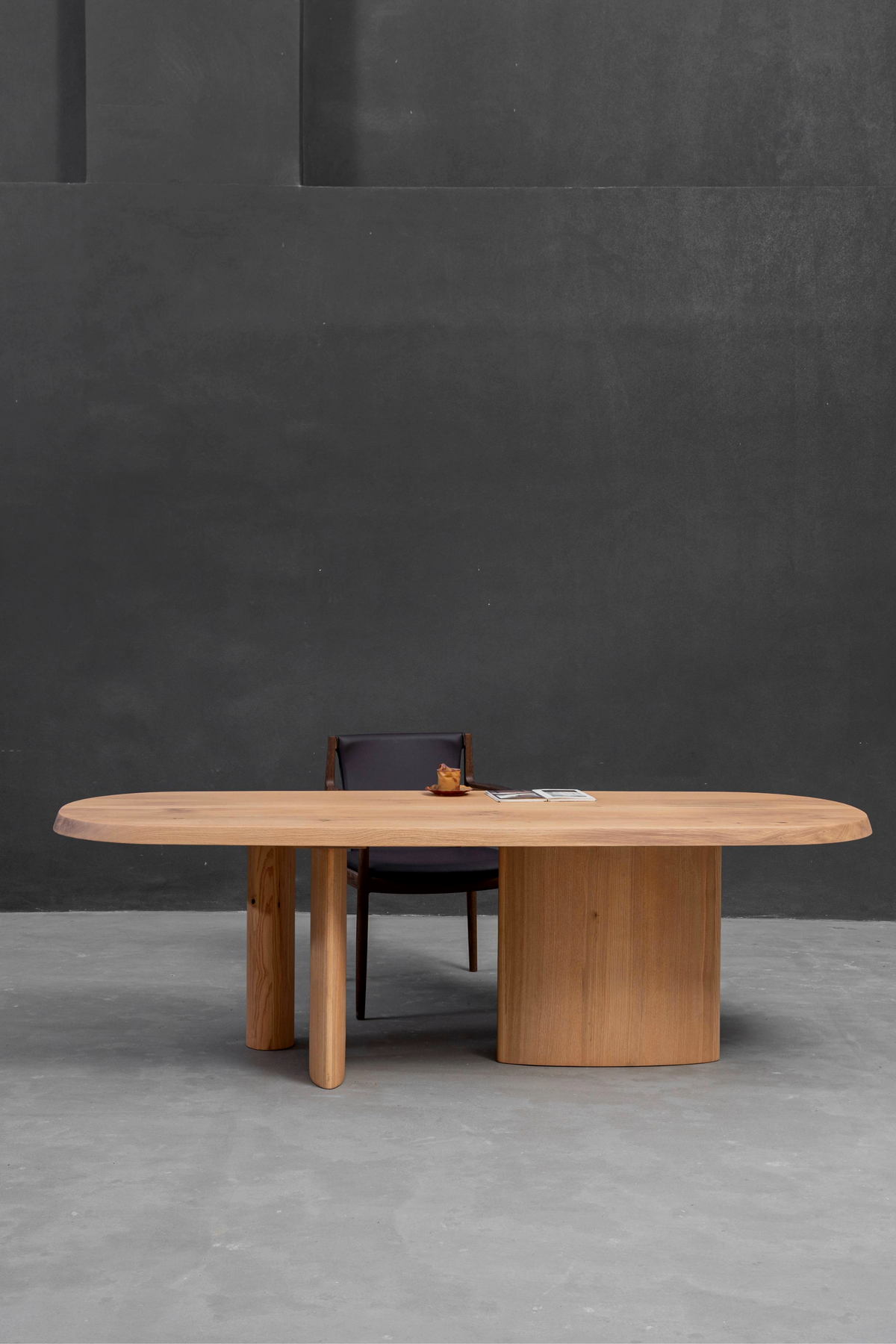 Side angle perspective highlighting the complete Fusion Table's light wood tones and clean profile.