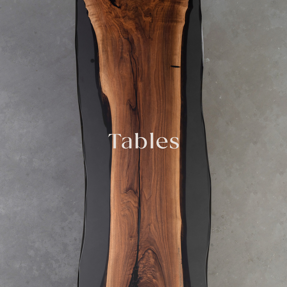 The Paradox Table, a live-edge dining table made from North American black walnut, showcasing rich wood grain and natural edges. Black ice resin fills the gaps between the wood, adding a striking contrast. Part of a high-end tables collection with a bold, modern design.