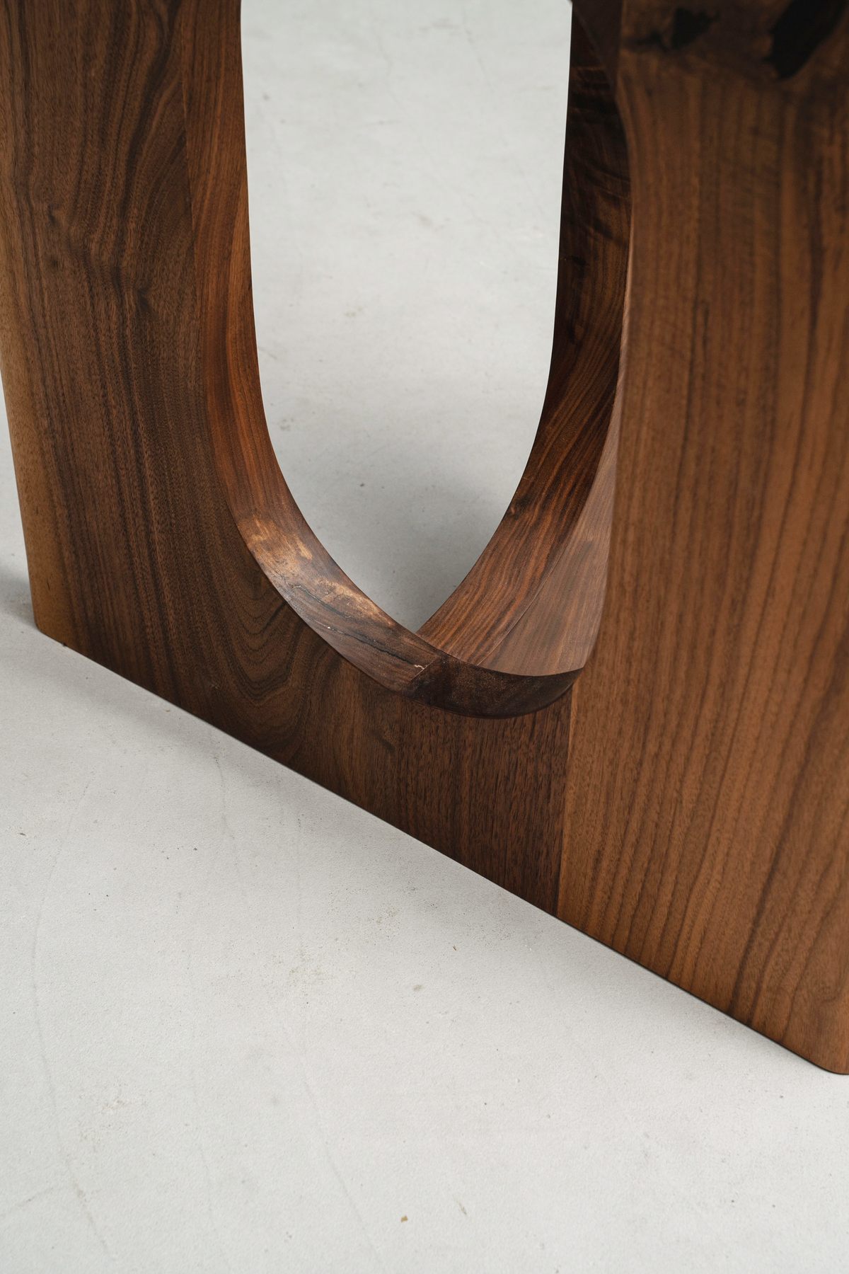 Wood joinery close-up in Pillars of Symposium, demonstrating traditional woodworking techniques.