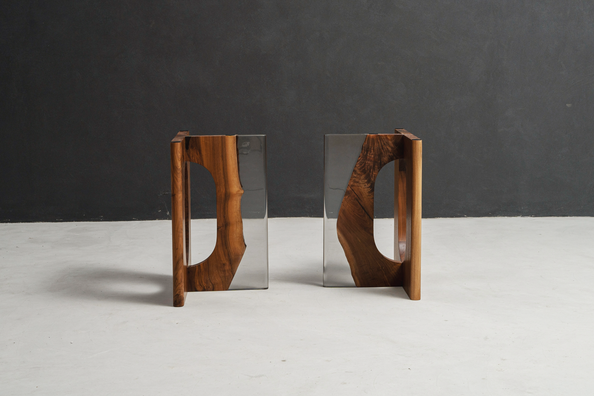 Pillars of Symposium luxury base with clear epoxy resin, designed for premium wood slab tables.