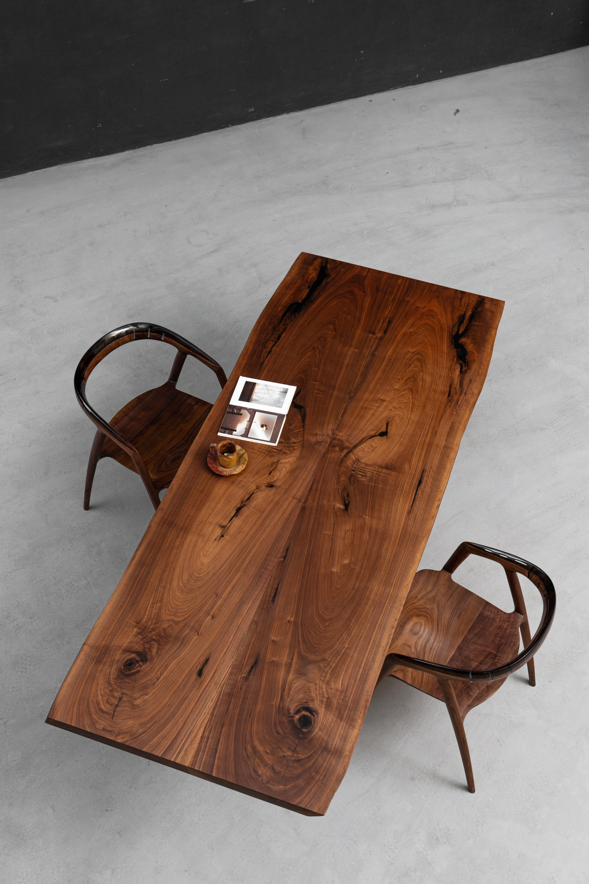 Impressive overhead angled shot of the wood slab, showcasing its dramatic grain and natural edge.