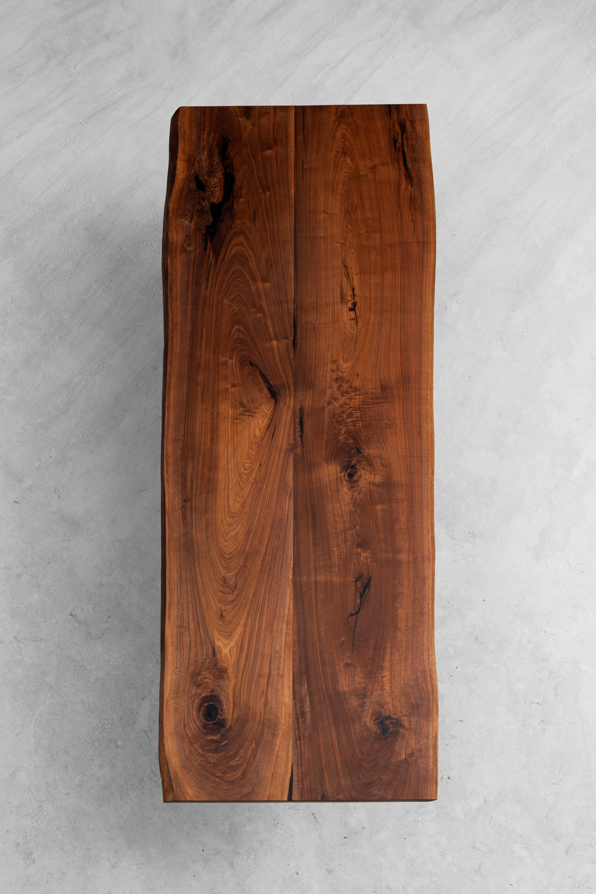 Aerial perspective demonstrating the table's proportions and presence within an interior space.