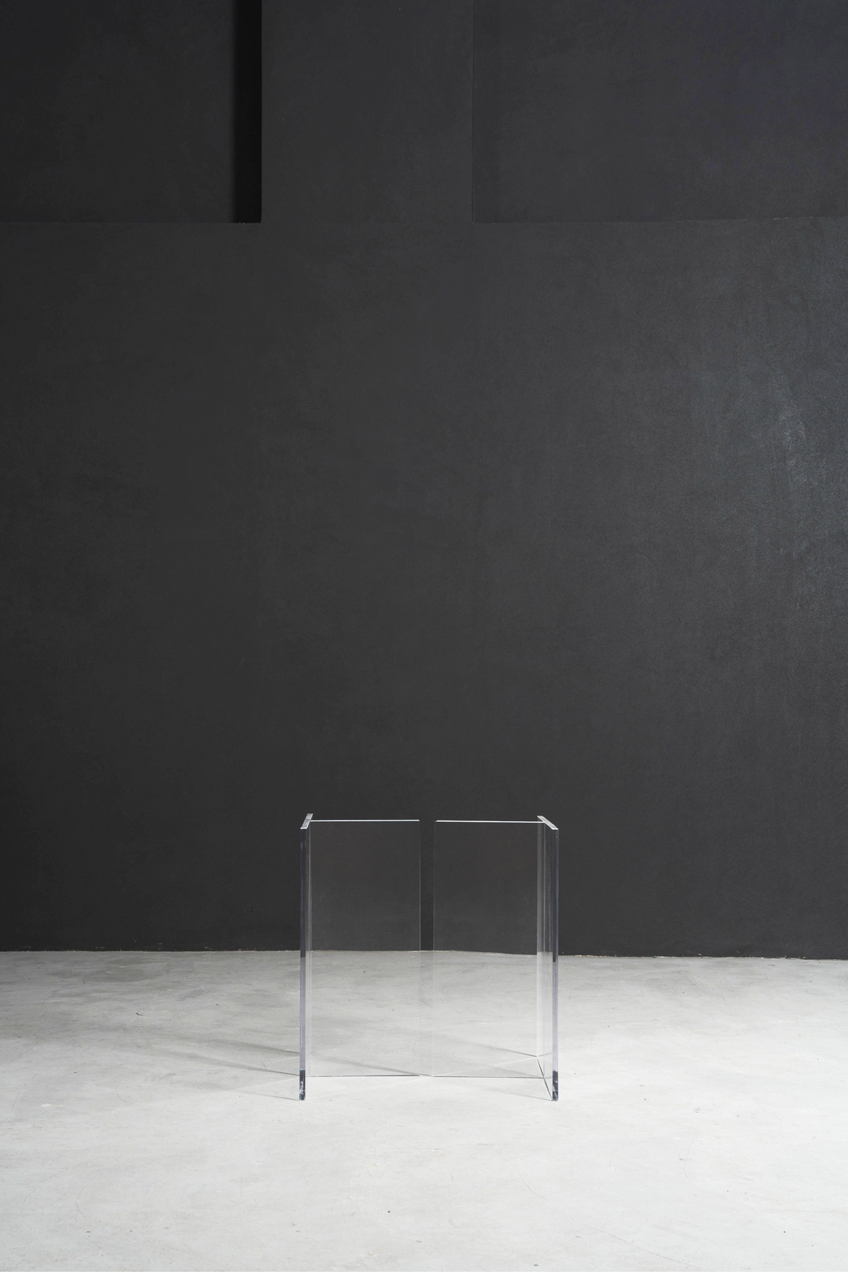 Full view of the paired clear acrylic bases in a minimalist setting, demonstrating their clean architectural lines.