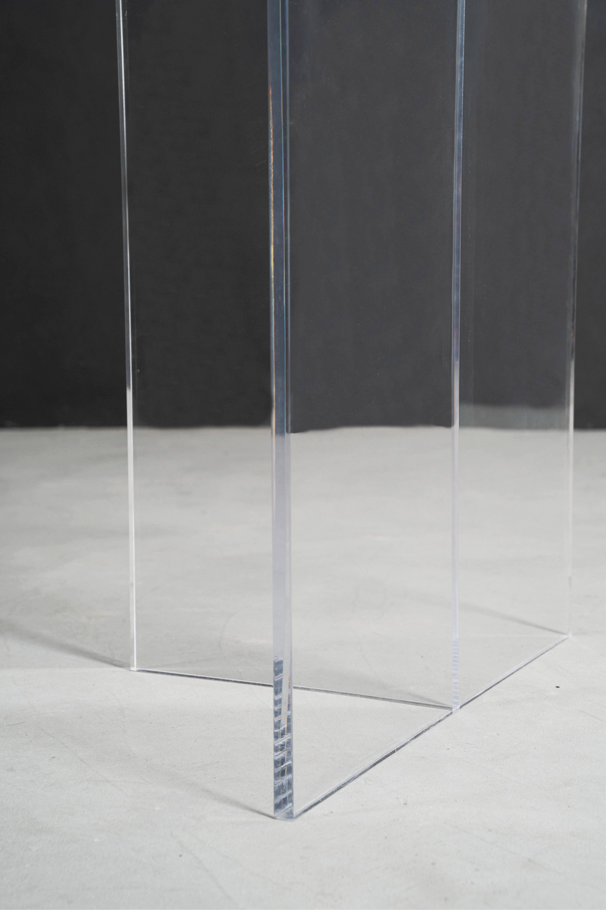 Low section view of the Silent T base at floor level, emphasizing how its transparent design preserves visual space.