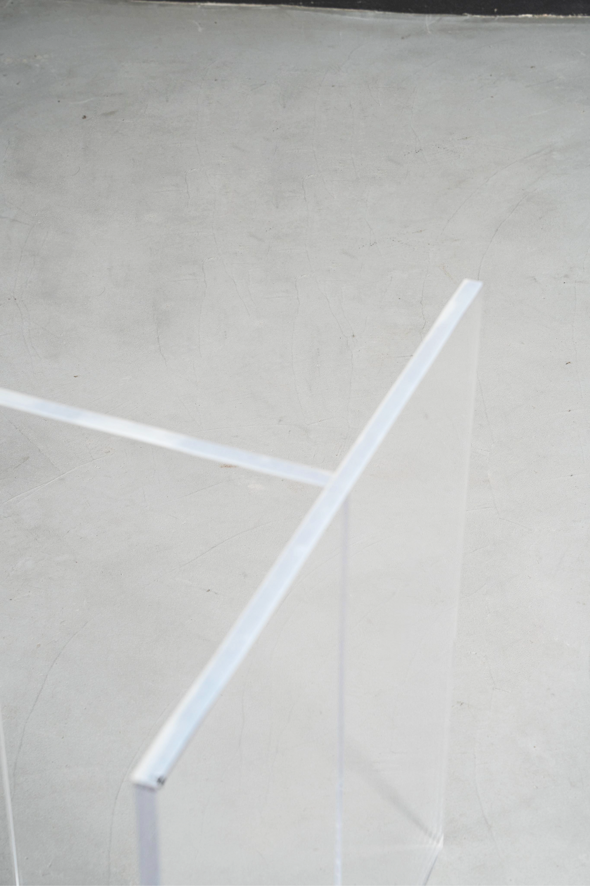 Close-up top perspective of the clear Silent T base, emphasizing its minimalist design and transparent support system.