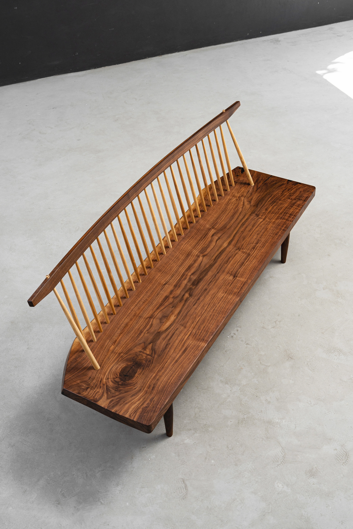 Angled top view of String Theory Bench featuring nature's woodgrain artistry on surface.