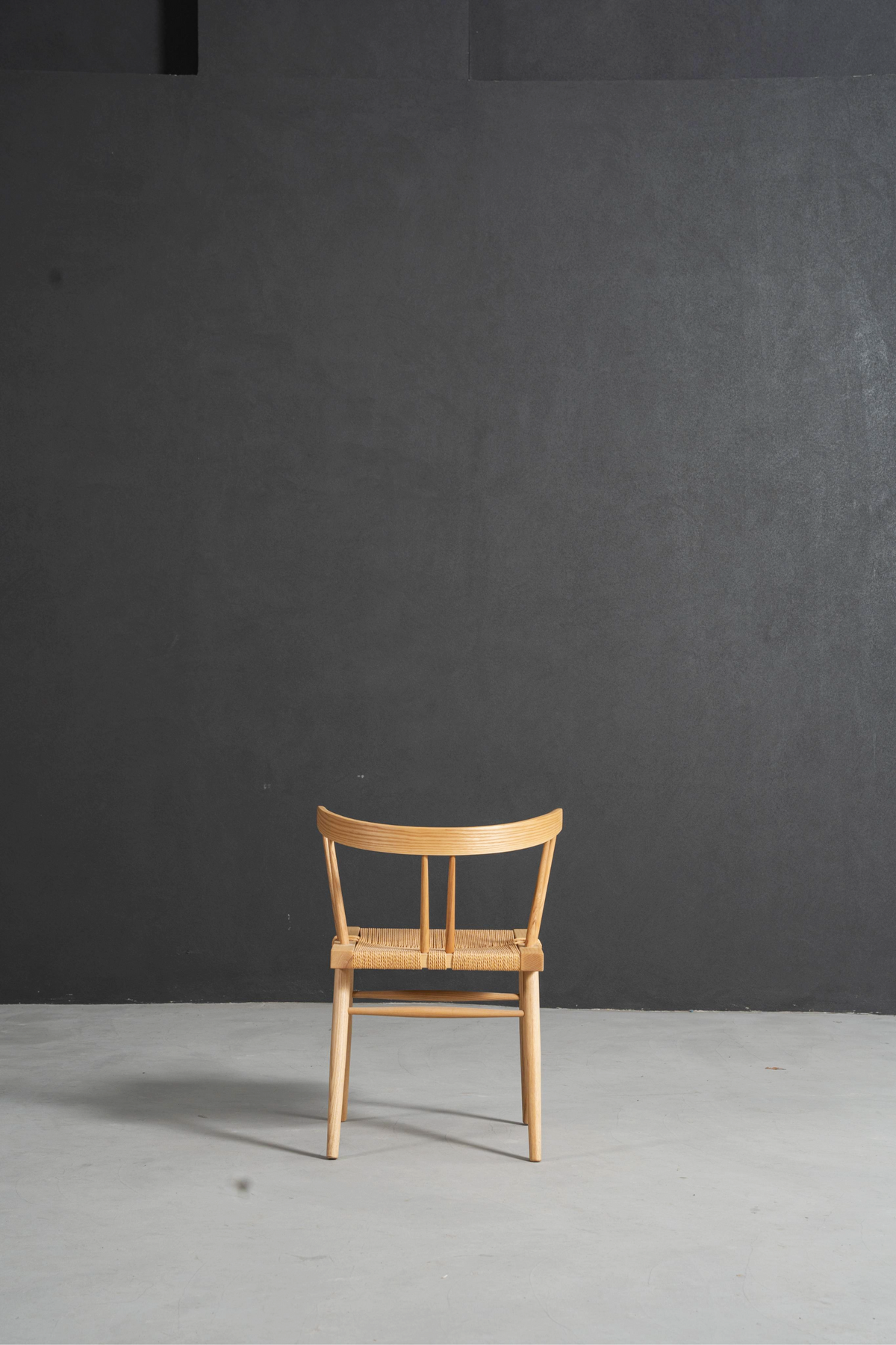 Full back view of Symphony Chair showing backrest and frame structure.