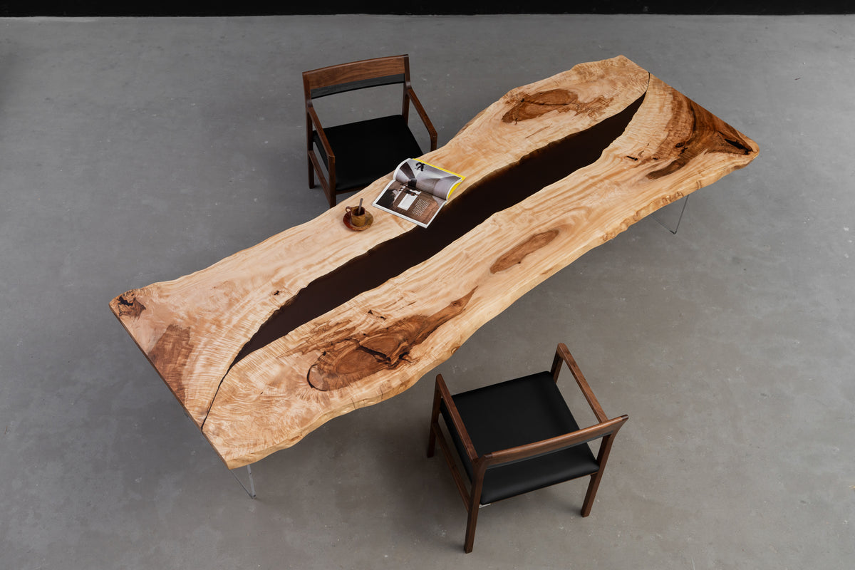 Tochi Horizon live-edge Japanese tochi dining table styled in interior setting to demonstrate scale and presence.