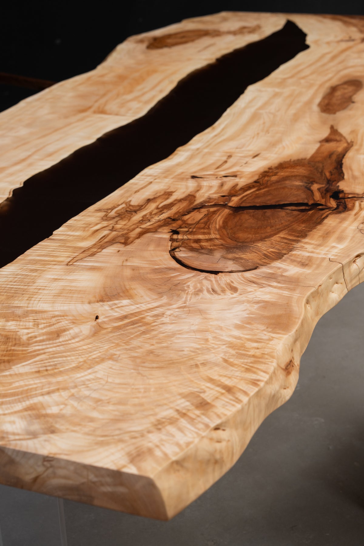 Close-up of Japanese horse chestnut grain on Tochi Horizon table revealing ice-crystal figure and texture.