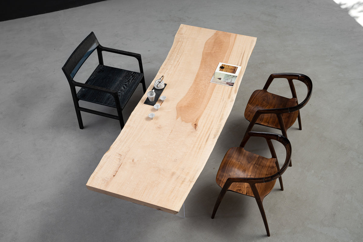 Tochi Kodama Japanese horse chestnut live-edge dining table with pale beige tone, sculpted edges, and refined surface.