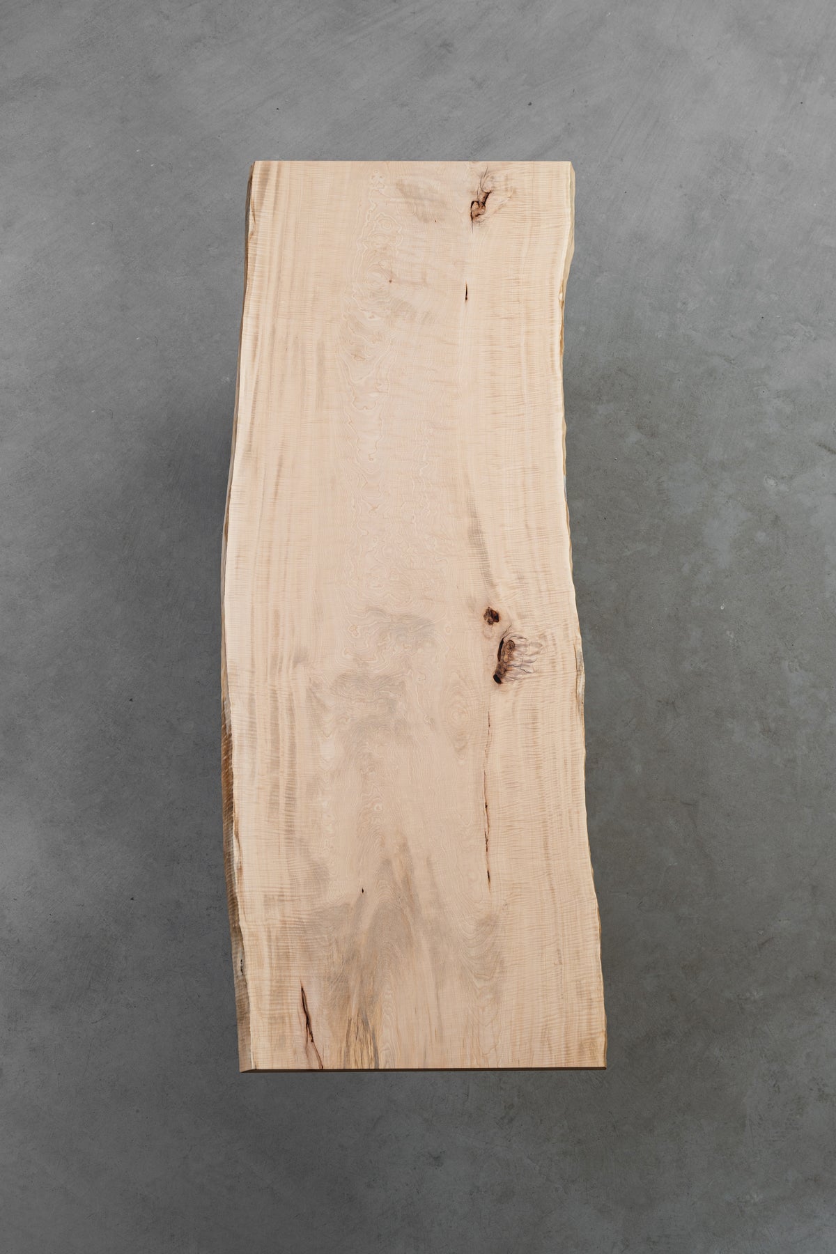 Overhead view of Tochi Kodama Japanese horse chestnut table underside showing organic live-edge form.