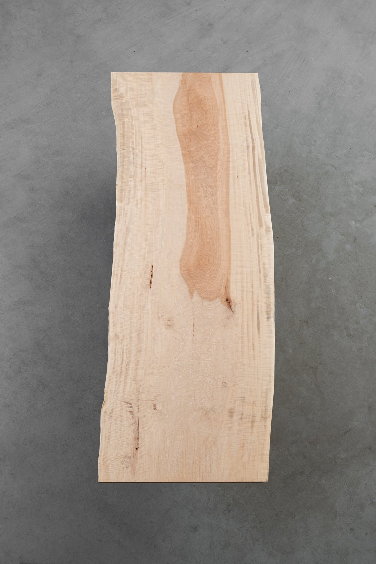 Overhead view of Tochi Kodama Japanese horse chestnut table showing soft grain clarity and organic live-edge form.