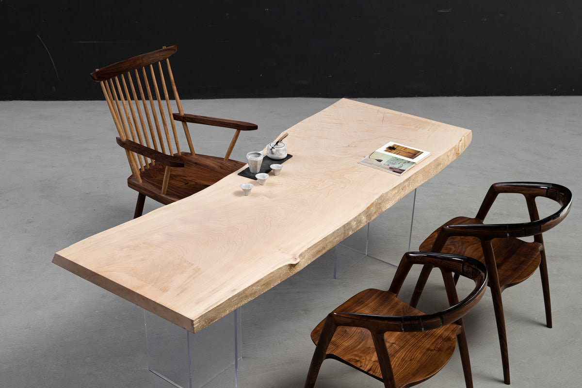 Perspective view of the Tochi Veil table illustrating its floating quality and modular compatibility for refined interiors