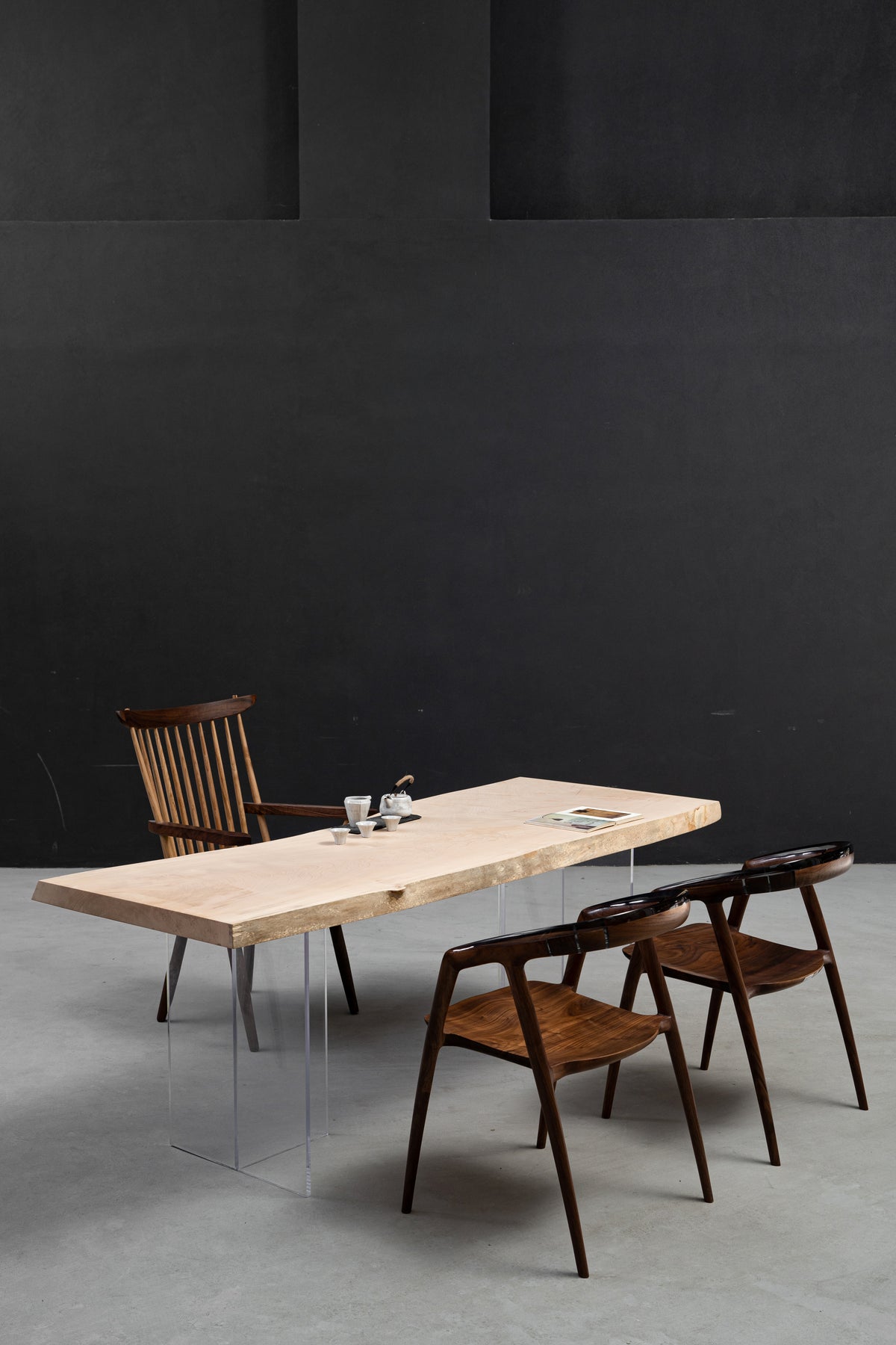 Tochi Veil Japanese Tochi table in a minimalist gallery setting, highlighting its thin-profile 5.3cm solid wood slab, by Woodslabs