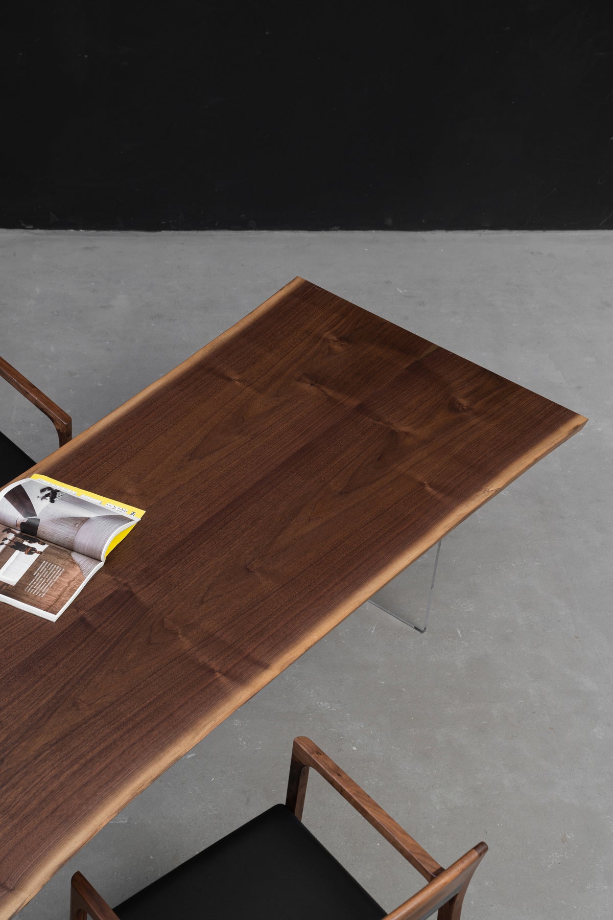 Duskwood Frontier live edge walnut dining table photographed on a neutral background to showcase form, material, and craftsmanship.