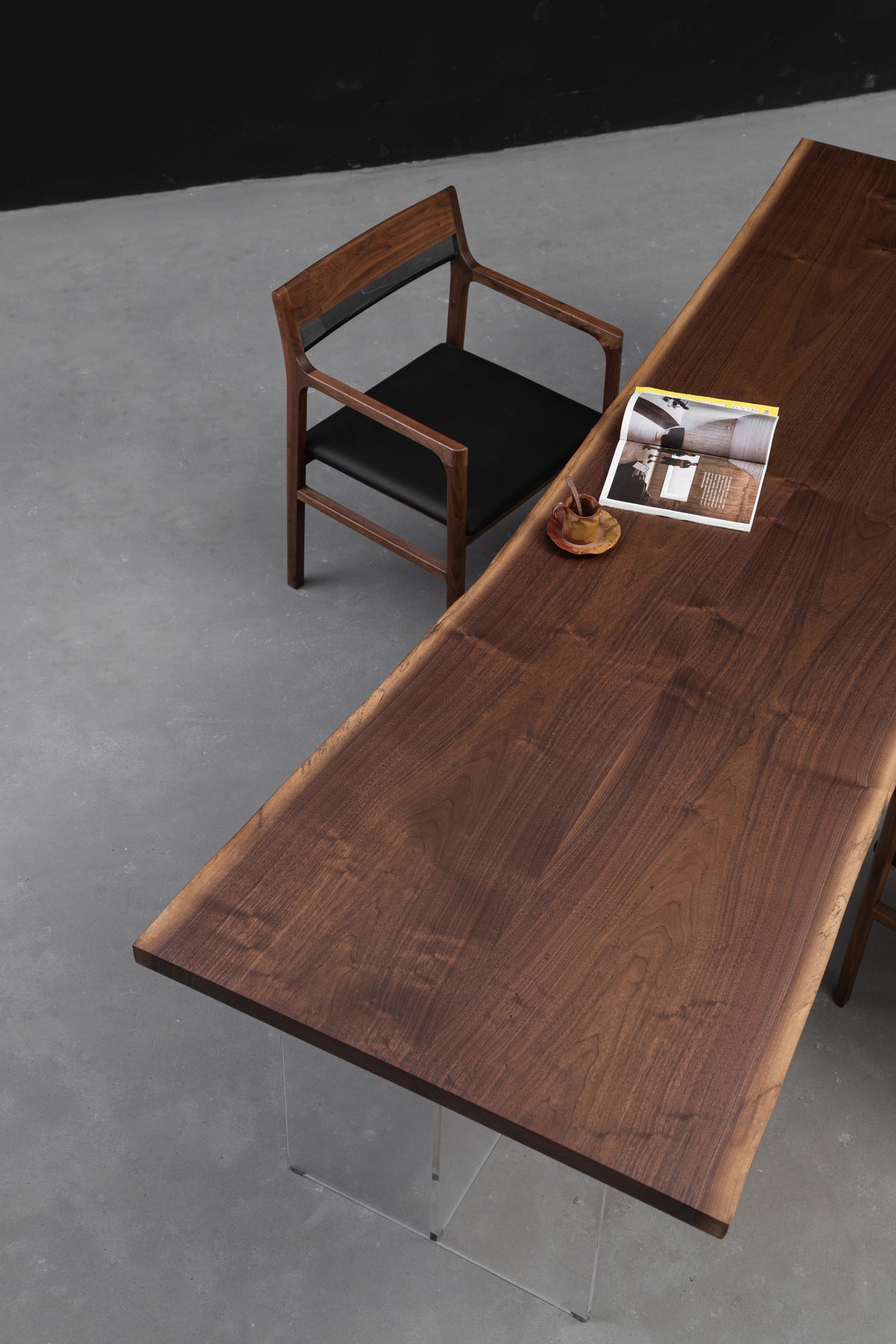 Duskwood Frontier live edge walnut dining table photographed on a neutral background to showcase form, material, and craftsmanship.