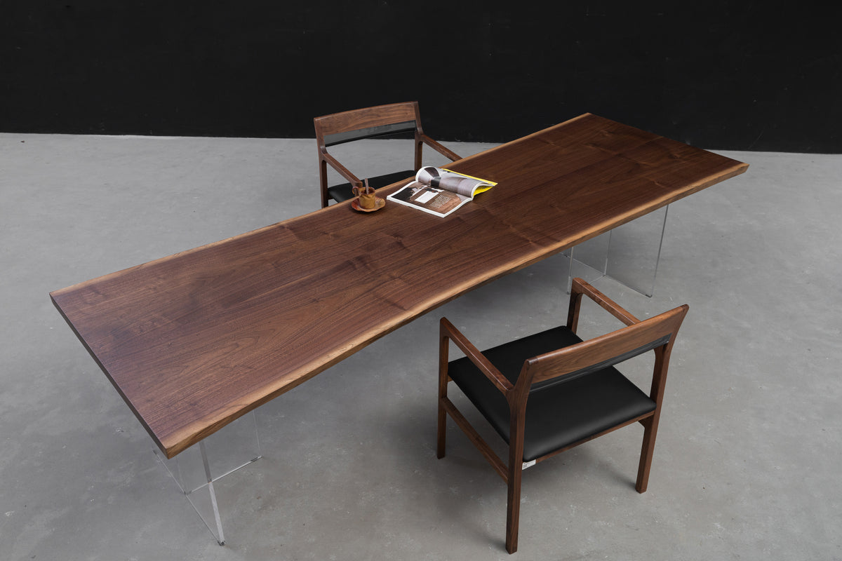 Wide angle perspective of the Duskwood Frontier Table in black walnut wood, with live edge and book-matched panels.