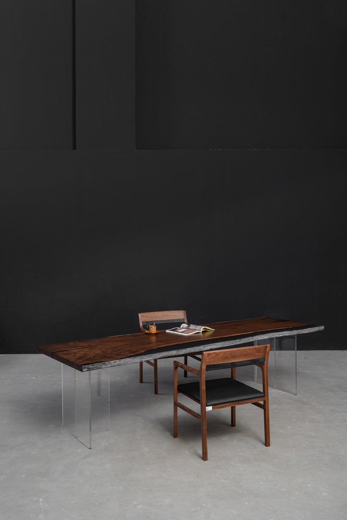 Portrait view of the Duskwood Midnight table highlighting dark wood grain, vertical framing, and refined surface detail