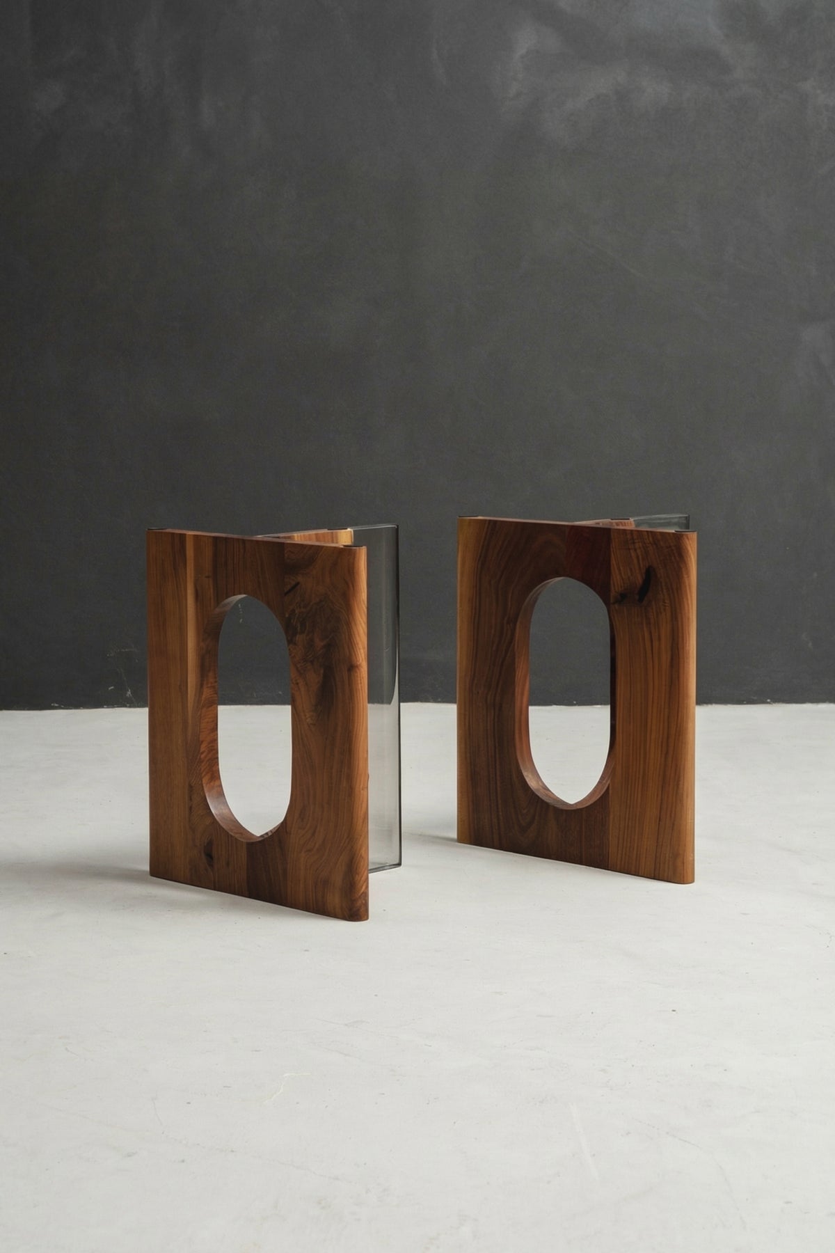 Pillars of Symposium table base in black walnut with clear crystal resin detailing, designed for live-edge wood slab tables